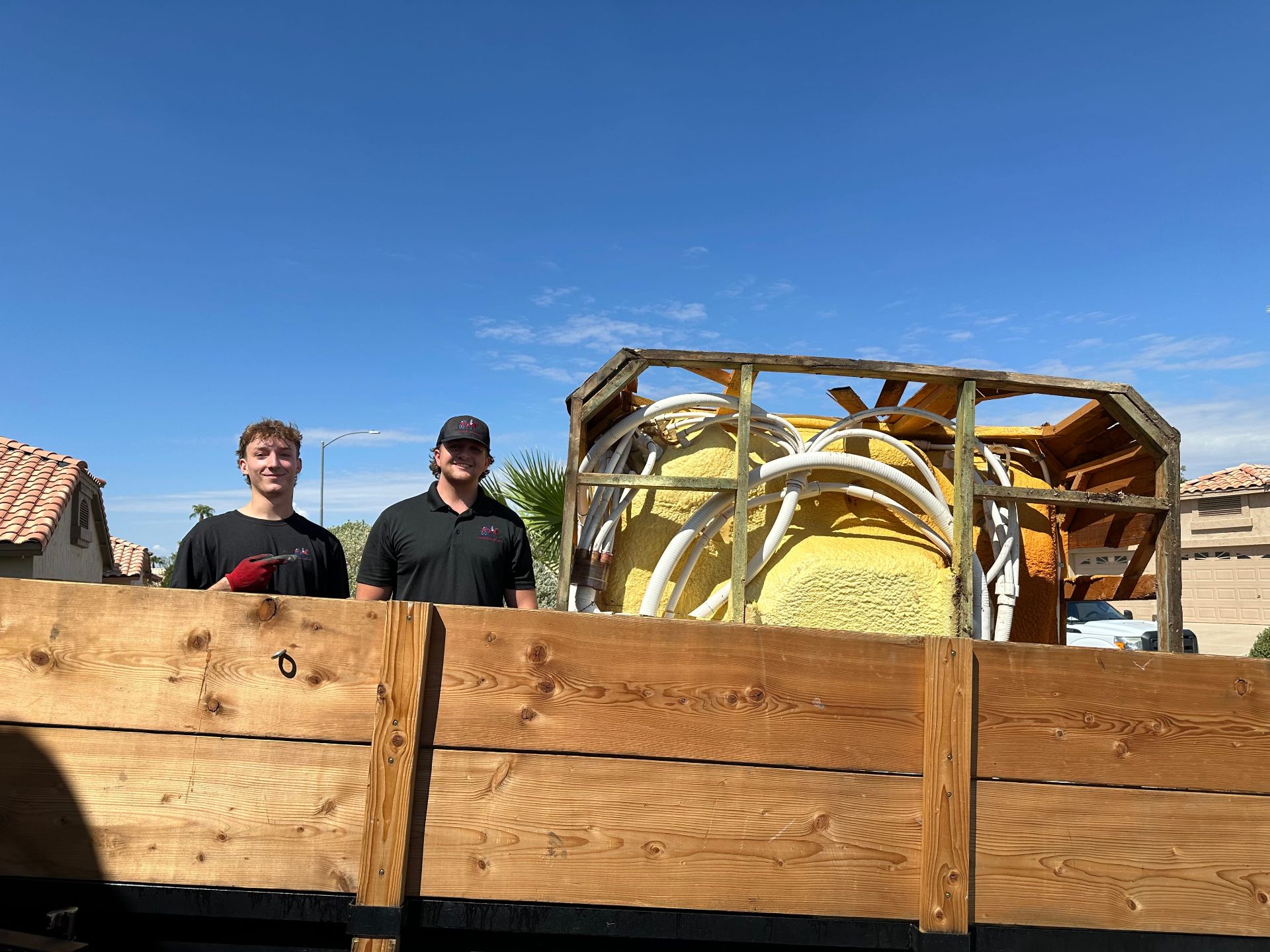 Minutemen Junk Removal crew with loaded trailer after a West Valley job